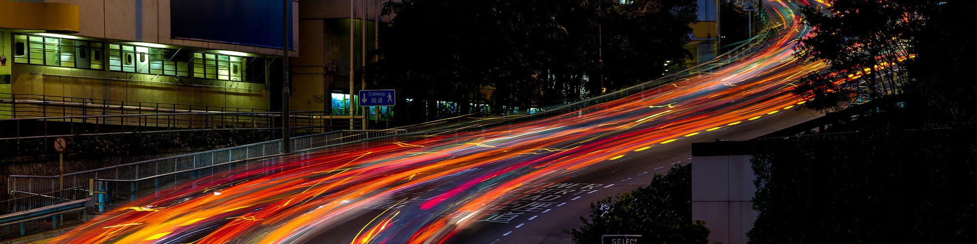 Nightime shot of a city a night who long exposure headlght streams.
